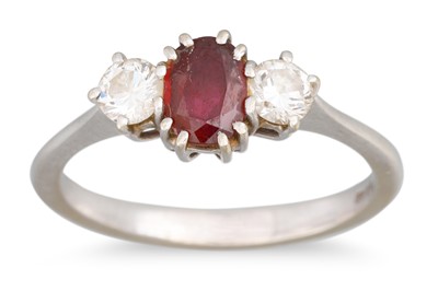 Lot 123 - A RUBY AND DIAMOND THREE STONE RING, mounted...
