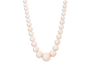 Lot 104 - A GRADUATED SET OF CORAL BEADS, the pale pink...