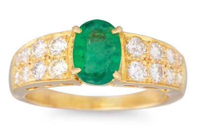 Lot 259 - AN EMERALD AND DIAMOND RING, the oval emerald...