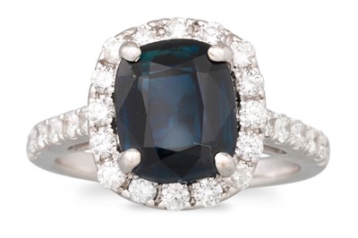 Lot 168 - A SAPPHIRE AND DIAMOND CLUSTER RING, cushion...