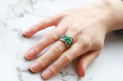 Lot 274 - AN EMERALD AND DIAMOND RING, the octagonal...