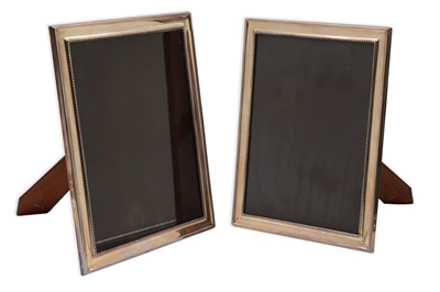 Lot 379 - A MODERN PAIR OF SPANISH SILVER PHOTO FRAMES,...