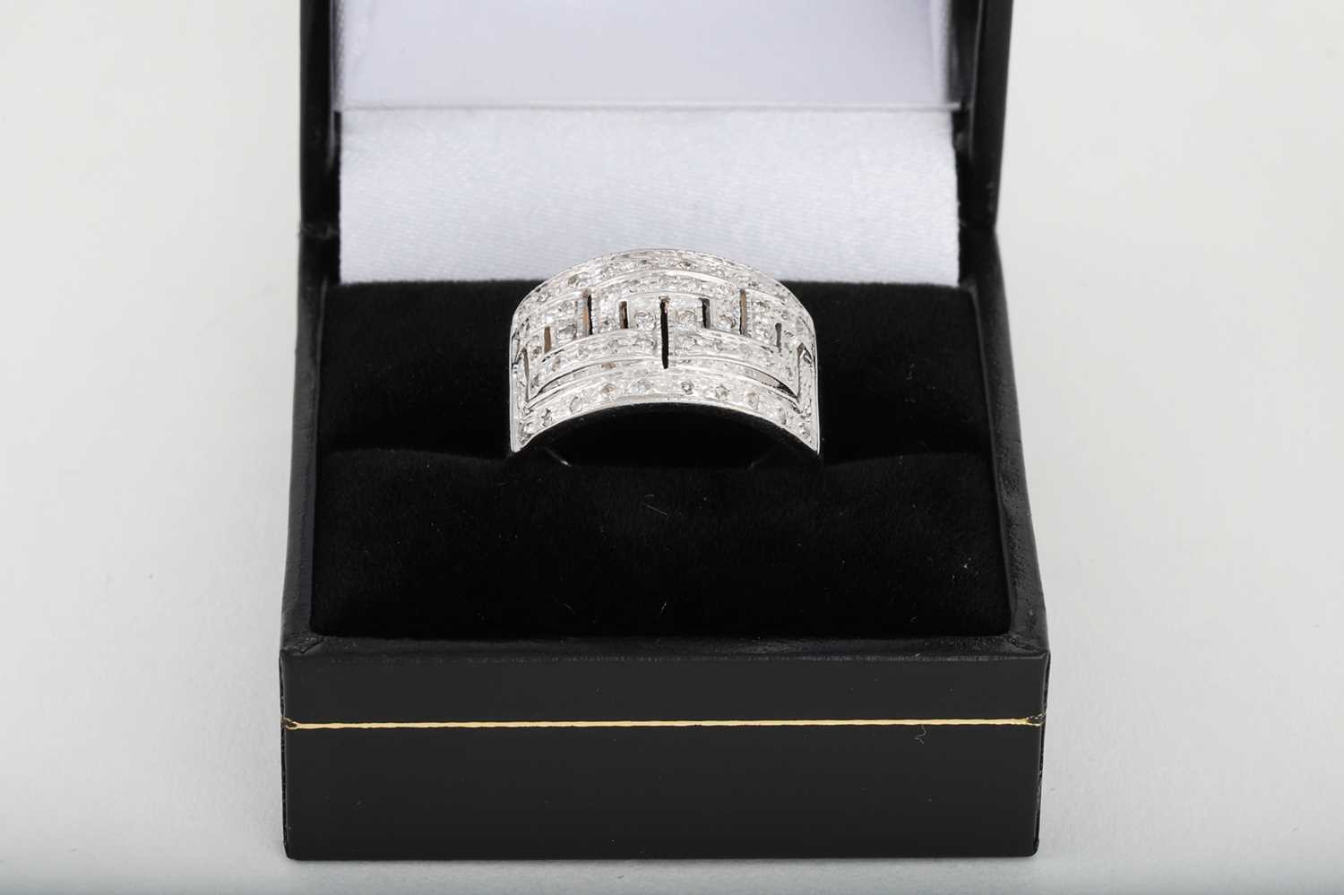 Lot 62 - A DIAMOND RING, Greek key design, in 9ct gold....