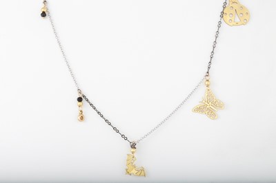 Lot 36 - A GOLD NECK CHAIN, suspending various charms,...