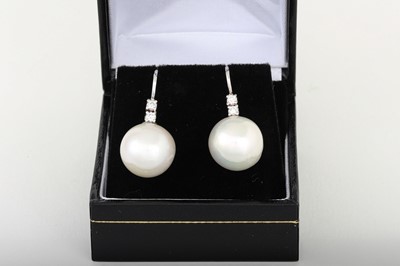 Lot 38 - A PAIR OF FRESH WATER PEARL AND DIAMOND DROP...