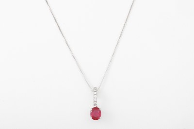Lot 51 - A DIAMOND AND RUBY PENDANT, the oval ruby to...