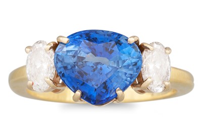 Lot 307 - A SAPPHIRE AND DIAMOND RING, the fancy cut...