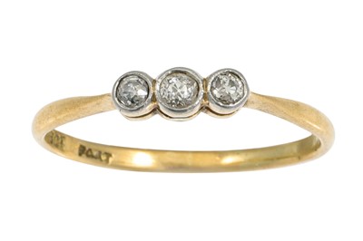 Lot 71 - A THREE STONE DIAMOND RING, mounted in gold....