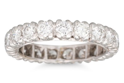 Lot 291 - A DIAMOND ETERNITY RING, the brilliant cut...