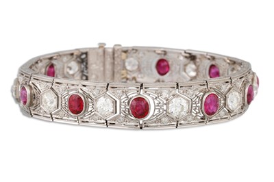 Lot 302 - AN ART DECO DIAMOND AND RUBY BRACELET, of open...