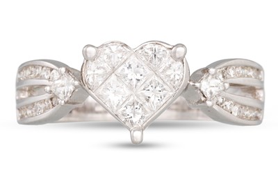 Lot 201 - A HEART SHAPED DIAMOND CLUSTER RING, set with...