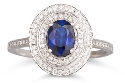 Lot 209 - A SAPPHIRE AND DIAMOND CLUSTER RING, the oval...