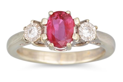 Lot 253 - A DIAMOND AND RUBY THREE STONE RING, the oval...