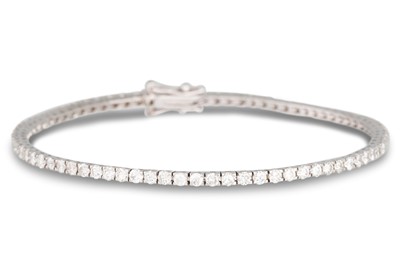 Lot 260 - A DIAMOND LINE BRACELET, the brilliant cut...