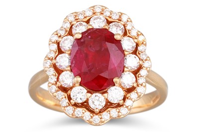 Lot 266 - A RUBY AND DIAMOND CLUSTER RING, the oval ruby...