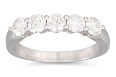 Lot 279 - A DIAMOND THREE STONE RING, the brilliant cut...