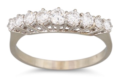 Lot 184 - A NINE STONE DIAMOND RING, the brilliant cut...