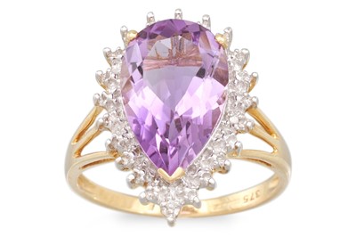 Lot 34 - A DIAMOND AND AMETHYST RING, the pear shaped...