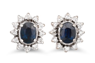 Lot 42 - A PAIR OF DIAMOND AND SAPPHIRE CLUSTER...
