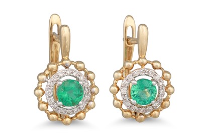Lot 71 - A PAIR OF DIAMOND AND EMERALD EARRINGS, oval...