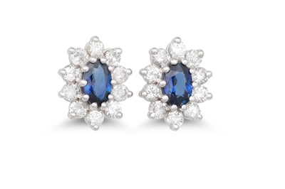 Lot 90 - A PAIR OF DIAMOND AND SAPPHIRE CLUSTER...