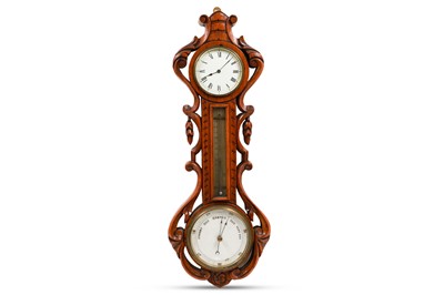 Lot 415 - AN EDWARDIAN BANJO BAROMETER, the carved oak...