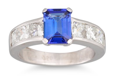 Lot 228 - A TANZANITE AND DIAMOND RING, the trap cut...