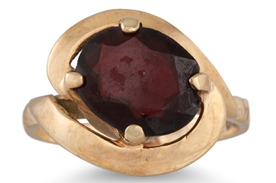 Lot 240 - A GARNET SET DRESS RING, mounted in 9ct yellow...