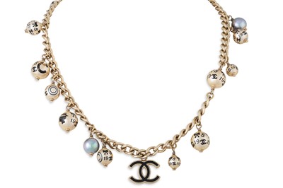 Lot 249 - A CHANEL BEADED CHARM NECKLACE, the curb link...