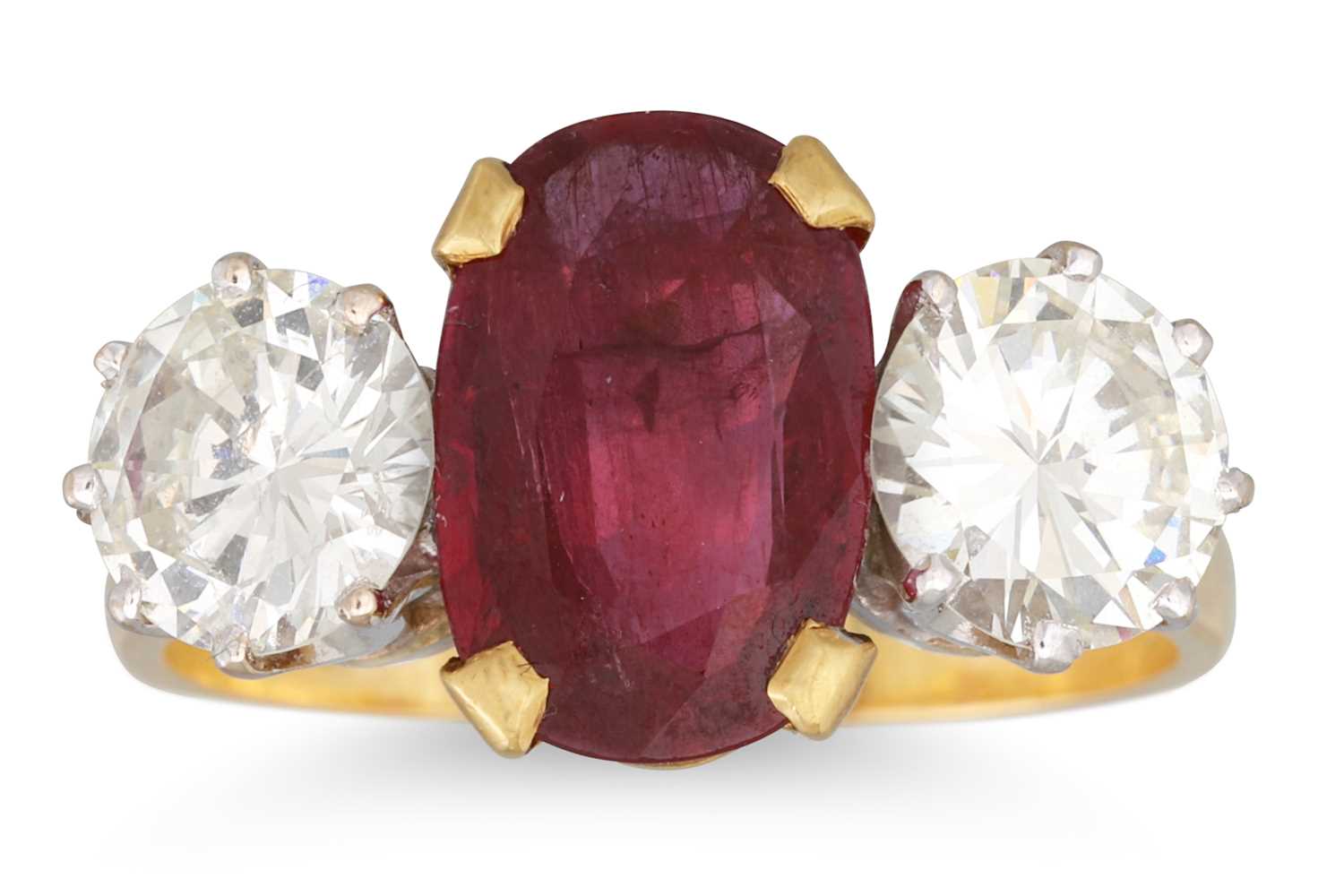 Lot 284 - A RUBY AND DIAMOND THREE STONE RING, the oval...