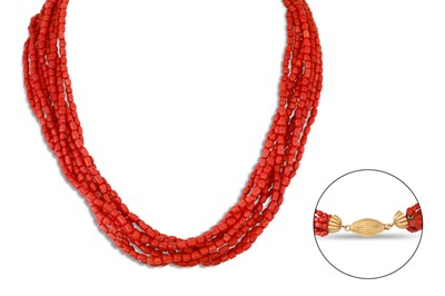 Lot 260 - A MULTI-STRANDED BEADED CORAL NECKLACE, to a...