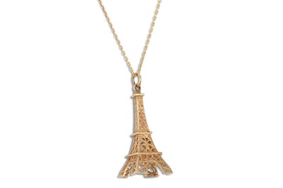 Lot 3 - A GOLD CHARM, in the form of the Eiffel Tower,...