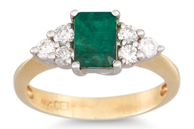 Lot 4 - AN EMERALD AND DIAMOND THREE STONE RING, the...