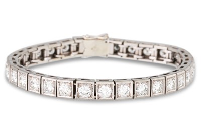 Lot 102 - A DIAMOND LINE BRACELET, set with thirty-two...