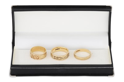 Lot 184 - THREE 10CT GOLD CELTIC BAND RINGS, 13.7 g....