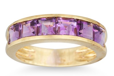 Lot 14 - AN AMETHYST BAND RING, the six channel set...