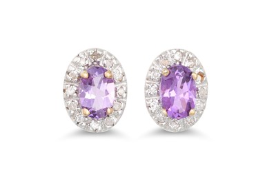 Lot 30 - A PAIR OF DIAMOND AND AMETHYST CLUSTER...