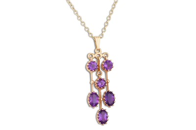 Lot 334 - AN AMETHYST DROP PENDANT, the six stone...