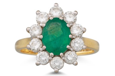 Lot 94 - AN EMERALD AND DIAMOND CLUSTER RING, the oval...