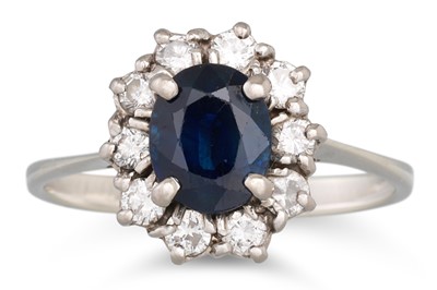 Lot 91 - A SAPPHIRE AND DIAMOND CLUSTER DRESS RING,...