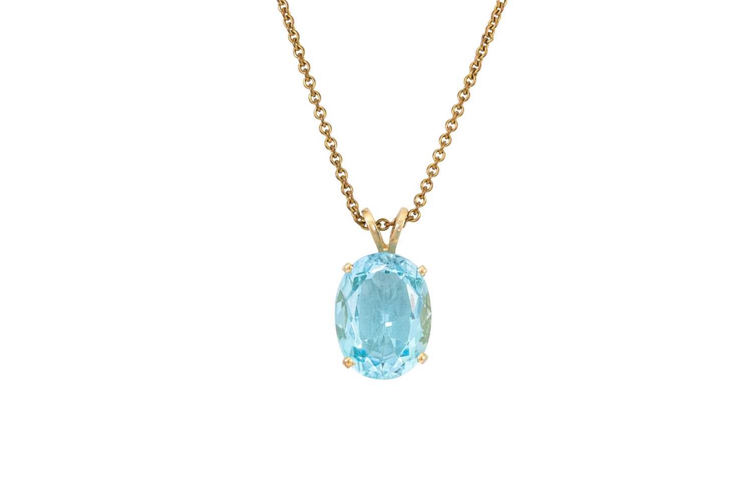 Lot 74 - A LARGE BLUE TOPAZ PENDANT, mounted in 14ct...