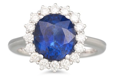 Lot 200 - A SAPPHIRE AND DIAMOND RING, the oval sapphire...