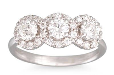 Lot 229 - A DIAMOND TRIPLE CLUSTER RING, set with...