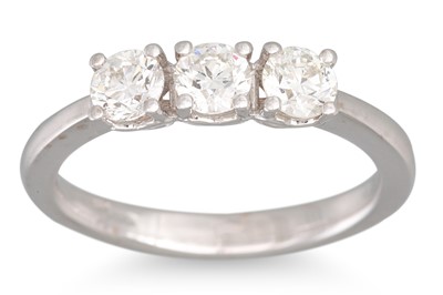 Lot 231 - A THREE STONE DIAMOND RING, mounted in 18ct...