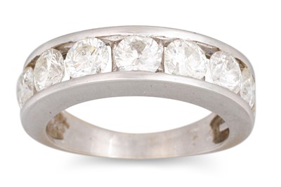 Lot 266 - A DIAMOND SEVEN STONE RING, the brilliant cut...