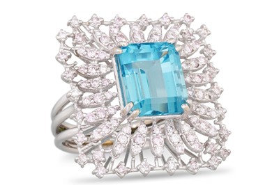 Lot 268 - A TOPAZ AND DIAMOND RING, the trap cut topaz...