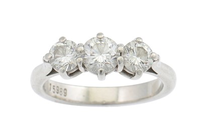 Lot 217 - A THREE STONE DIAMOND RING, mounted in...