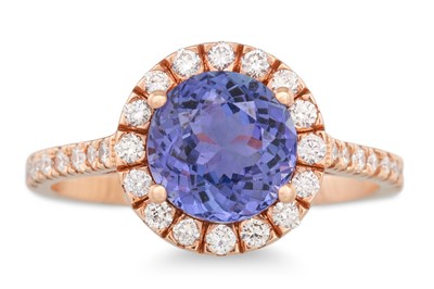 Lot 129 - A TANZANITE AND DIAMOND CLUSTER RING, the...