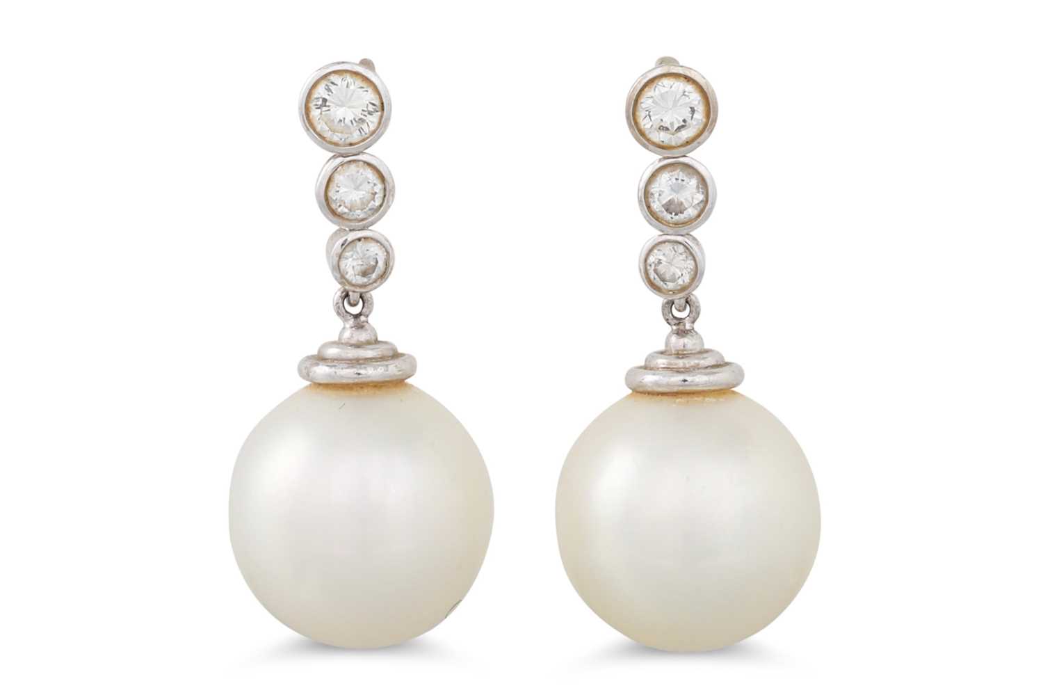 Lot 47 - A PAIR OF PEARL AND DIAMOND DROP EARRINGS, the...