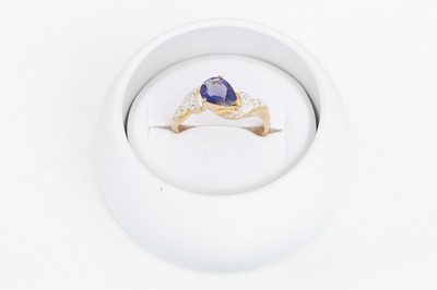 Lot 264 - A DIAMOND AND TANZANITE RING, mounted in 9ct...